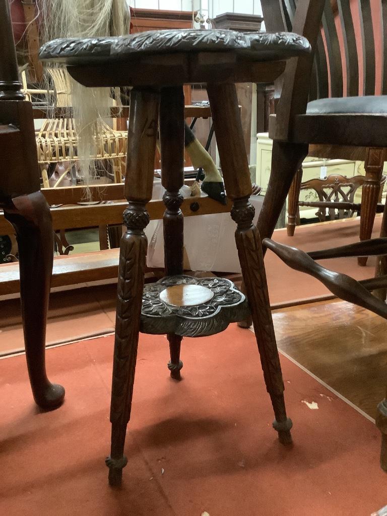 An early 20th century Indian carved hardwood occasional table, width 32cm height 54cm